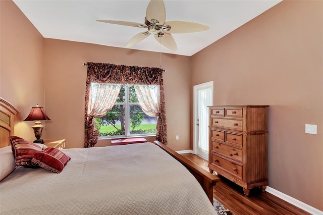 bedroom featuring ceiling fan and dark hardwood / wood-style flooring