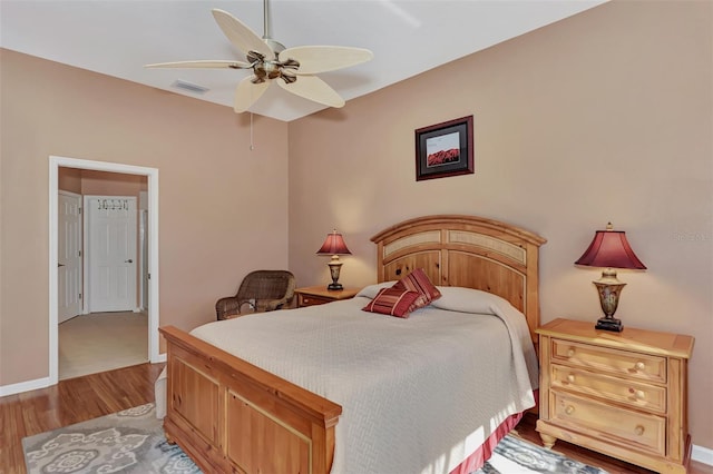 bedroom with ceiling fan and light hardwood / wood-style flooring