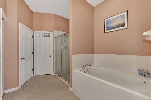 bathroom with tile patterned floors and independent shower and bath