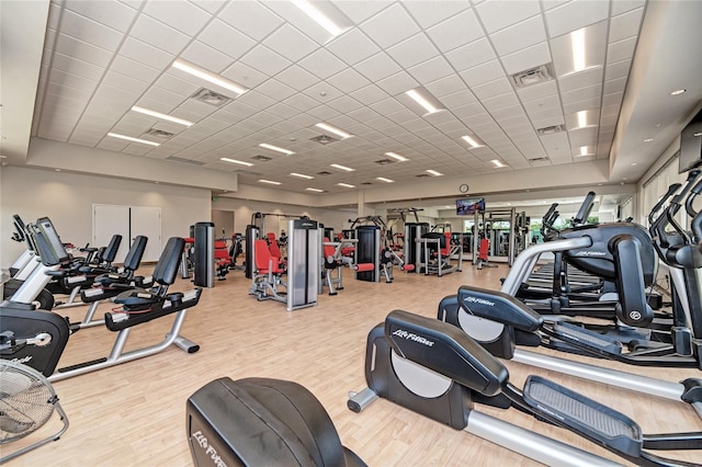 workout area with visible vents and wood finished floors