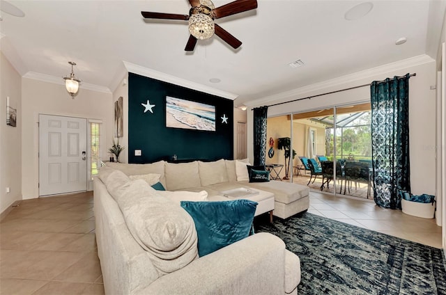 living room featuring light tile patterned flooring, ornamental molding, and ceiling fan