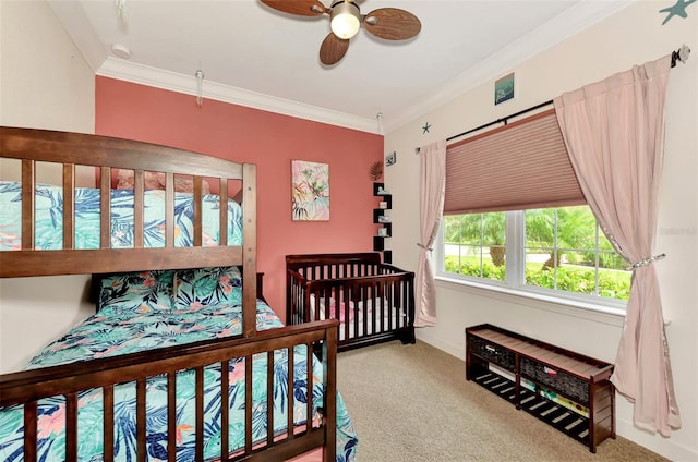 bedroom with ceiling fan, ornamental molding, and carpet