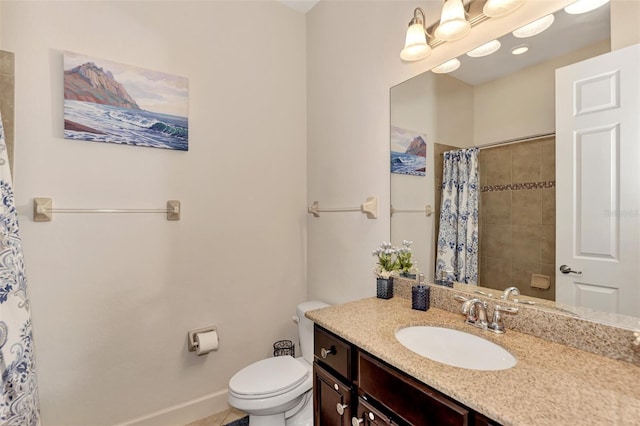 bathroom featuring vanity, toilet, and a shower with shower curtain