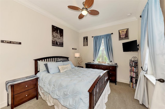 carpeted bedroom featuring ornamental molding and ceiling fan