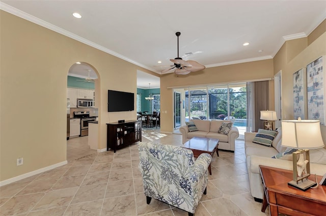 living room featuring ornamental molding and ceiling fan with notable chandelier