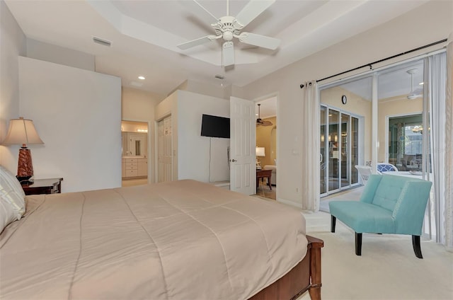 bedroom featuring connected bathroom, access to outside, light carpet, and ceiling fan