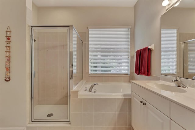 bathroom featuring vanity and separate shower and tub