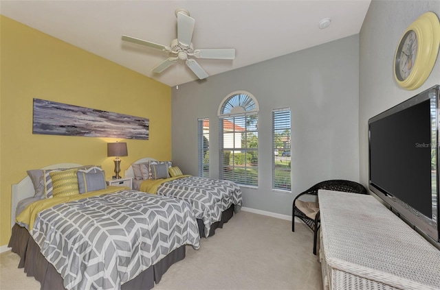 carpeted bedroom featuring ceiling fan and lofted ceiling