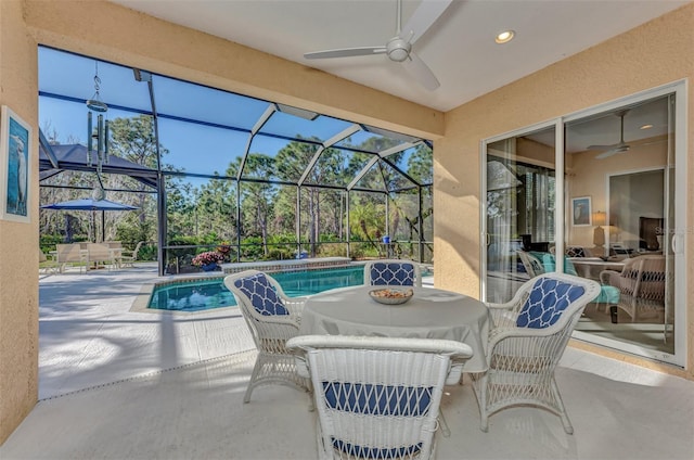 view of patio / terrace with a lanai and ceiling fan