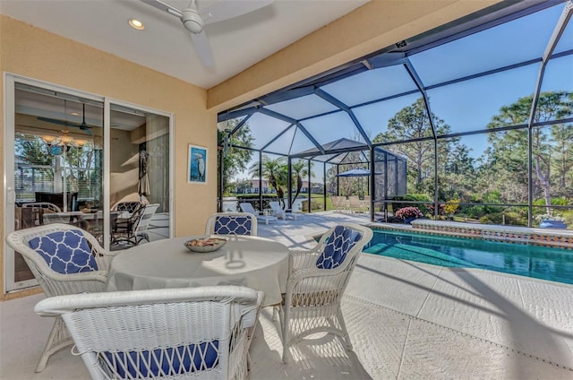 view of pool featuring ceiling fan, a lanai, and a patio area