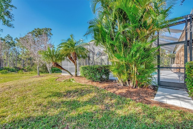 view of yard with a lanai