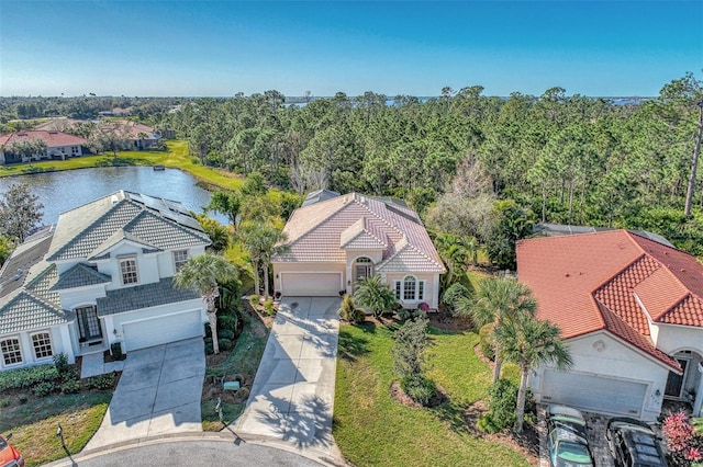 birds eye view of property featuring a water view