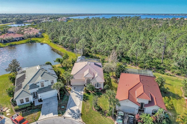 drone / aerial view with a water view