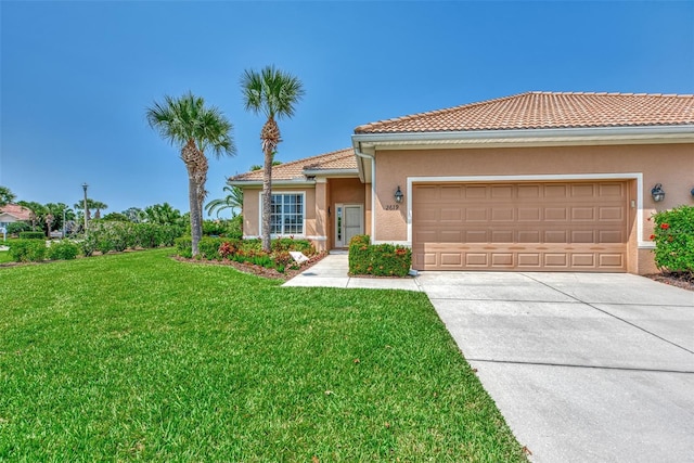 view of front facade with a garage and a front yard