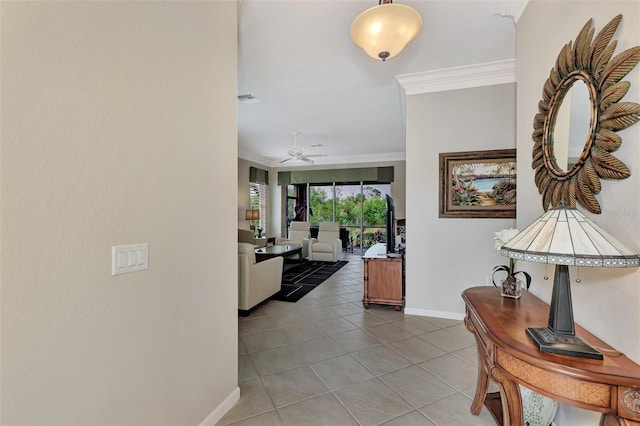 hall featuring tile patterned floors and crown molding