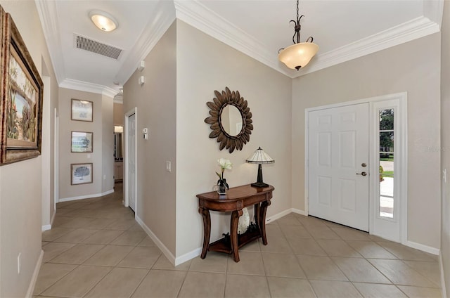 tiled foyer featuring ornamental molding