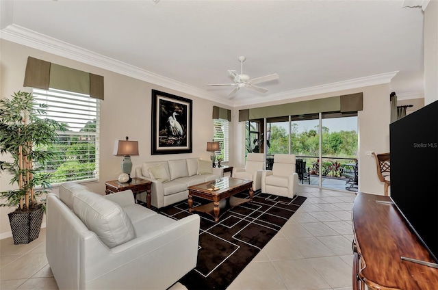 living room featuring ornamental molding, ceiling fan, and a healthy amount of sunlight