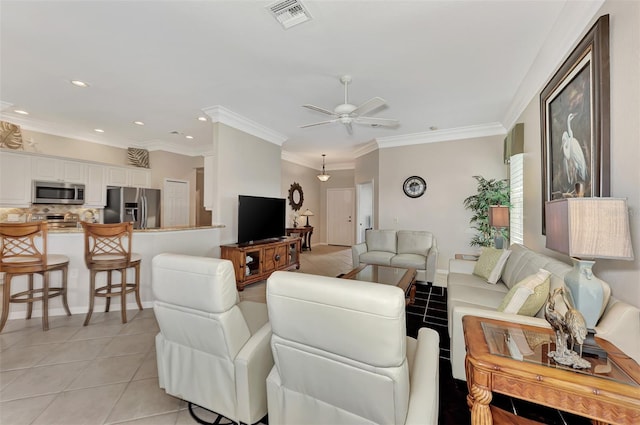 tiled living room featuring ceiling fan and ornamental molding