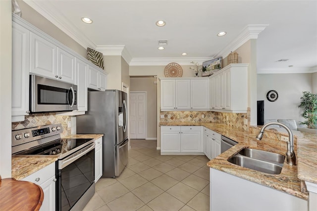 kitchen with white cabinetry, stainless steel appliances, and sink