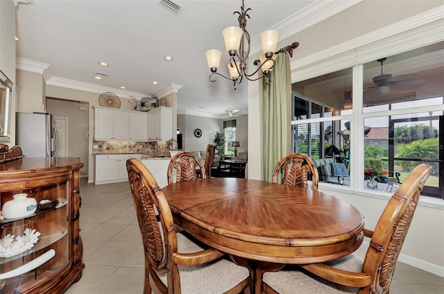 tiled dining room featuring ornamental molding and ceiling fan with notable chandelier