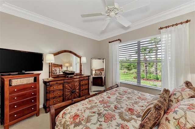 carpeted bedroom with ceiling fan, multiple windows, and crown molding