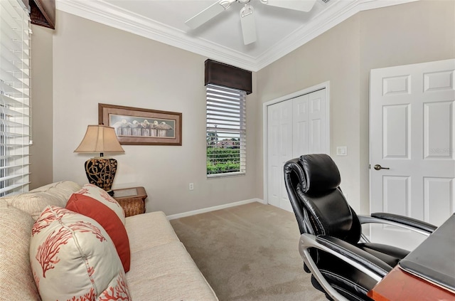 home office with carpet flooring, ceiling fan, and crown molding