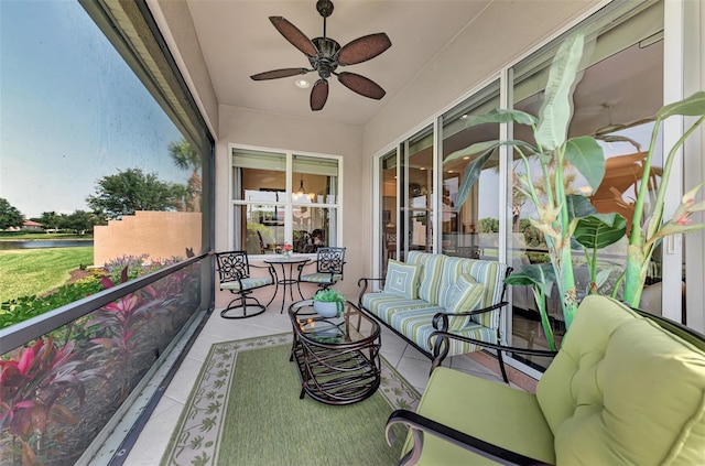 view of patio with outdoor lounge area and ceiling fan