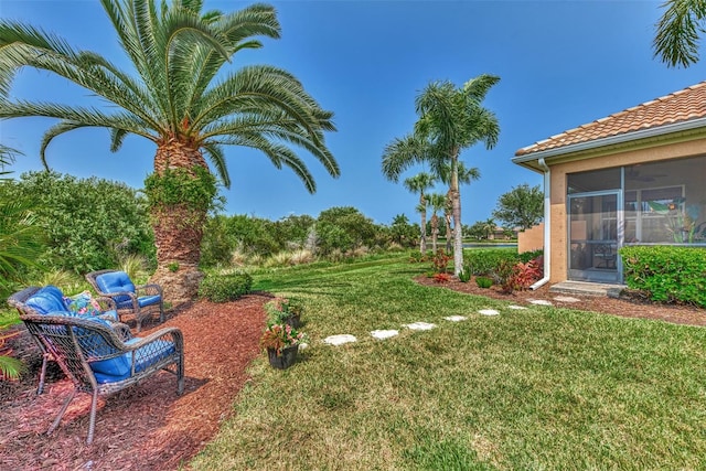 view of yard with a sunroom