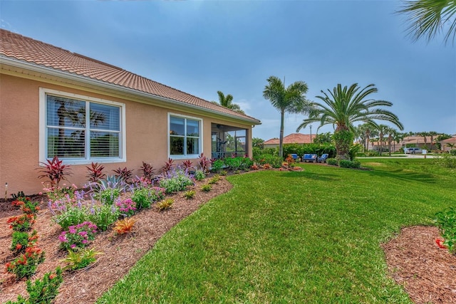 view of yard with a sunroom