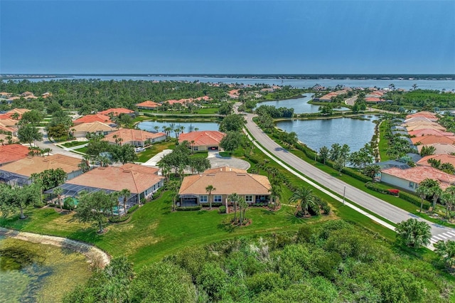 drone / aerial view with a water view