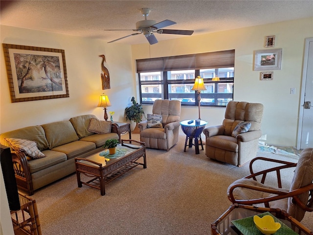 carpeted living room featuring a textured ceiling and ceiling fan