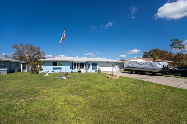 view of front of house with a garage and a front lawn