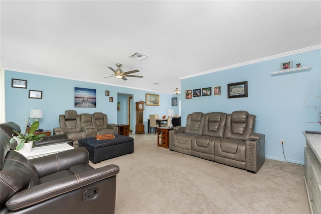 living room with ceiling fan, crown molding, a textured ceiling, and light colored carpet