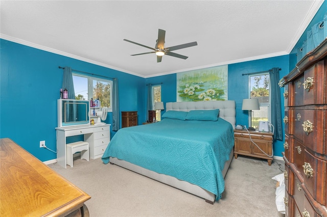 bedroom featuring ornamental molding, light carpet, and ceiling fan