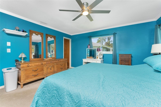 carpeted bedroom featuring crown molding and ceiling fan