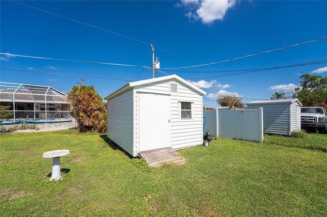 view of outbuilding featuring a yard