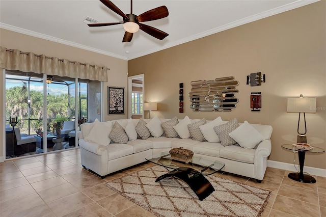 living room featuring ornamental molding, light tile patterned floors, and ceiling fan