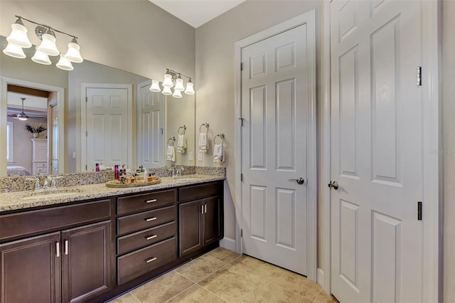 bathroom with vanity, ceiling fan, and tile patterned flooring