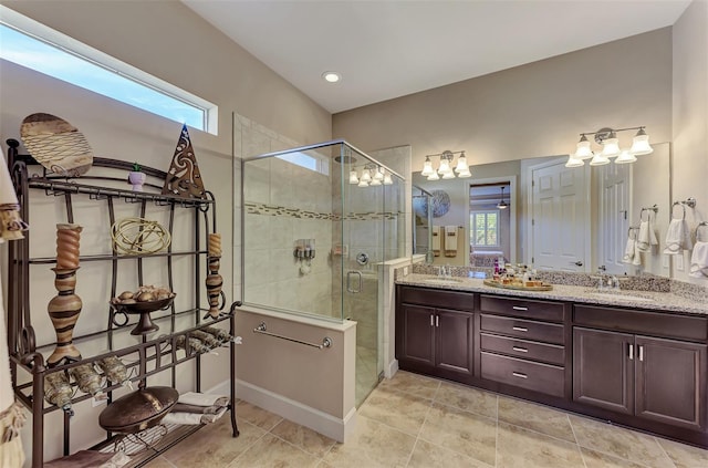 bathroom featuring vanity and an enclosed shower