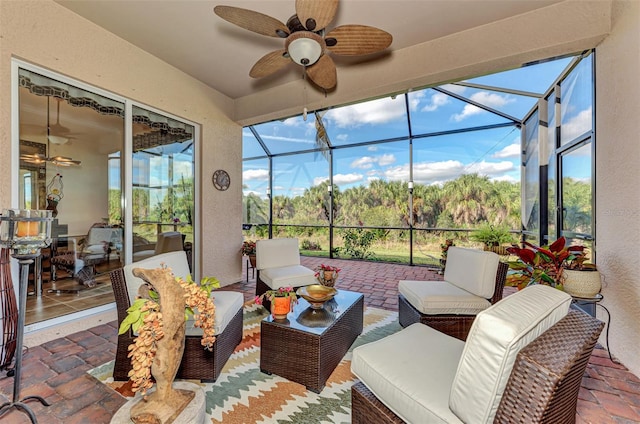 sunroom featuring a wealth of natural light and ceiling fan