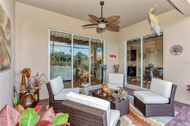 sunroom with ceiling fan