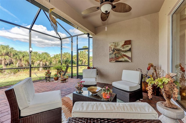 sunroom featuring a wealth of natural light and ceiling fan