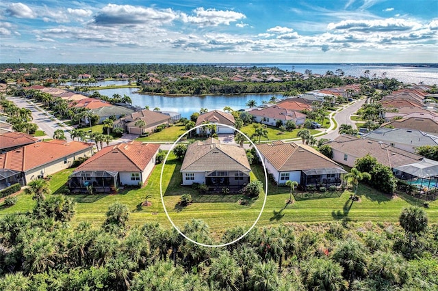 drone / aerial view featuring a water view