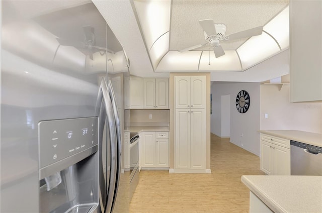 kitchen featuring light hardwood / wood-style floors, appliances with stainless steel finishes, and ceiling fan