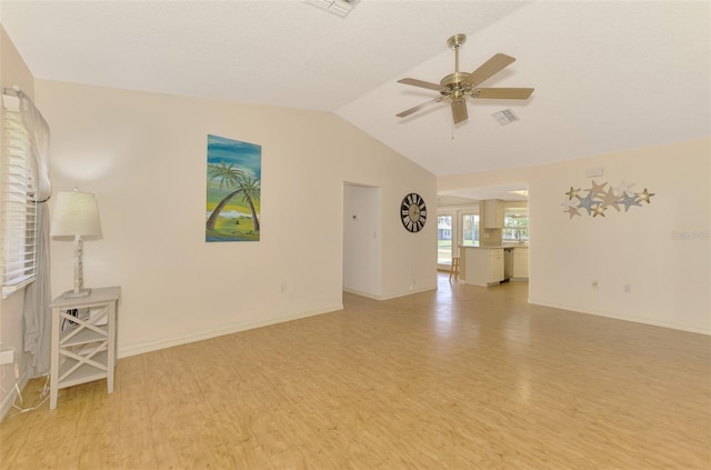 unfurnished room featuring light hardwood / wood-style floors, lofted ceiling, and ceiling fan