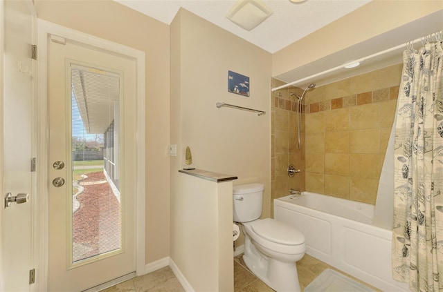 bathroom featuring tile patterned flooring, toilet, and shower / bath combo