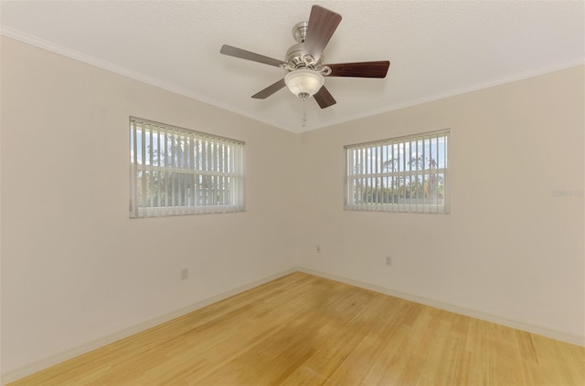 spare room with crown molding and hardwood / wood-style floors