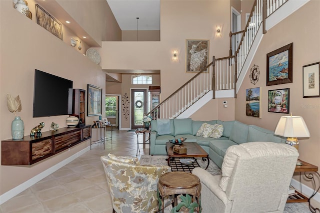 living room featuring a towering ceiling