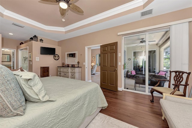 bedroom featuring access to outside, a raised ceiling, ceiling fan, hardwood / wood-style flooring, and ornamental molding