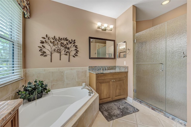 bathroom with vanity, plus walk in shower, and tile patterned flooring